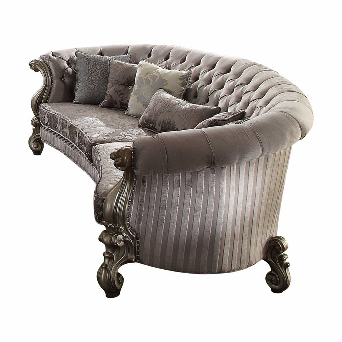 Gray velvet curved floral sofa with champagne legs and matching toss pillows, stylish stationary sofa by HomeRoots.