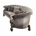 Gray velvet curved floral sofa with champagne legs and matching toss pillows, stylish stationary sofa by HomeRoots.