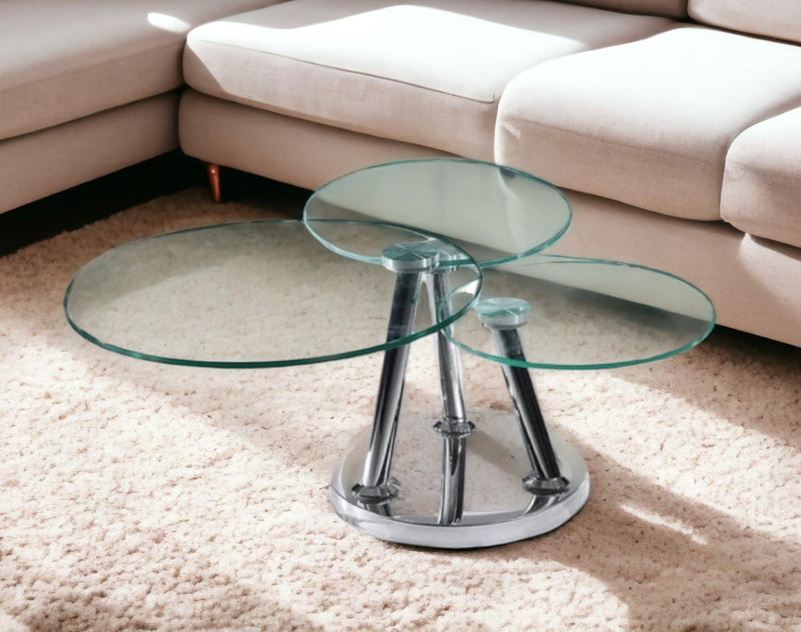 HomeRoots 32-inch glass and metal round coffee table with clear glass top and silver metal frame, modern living room decor.