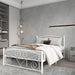 Giga white metal platform bed frame with unique flower design, headboard, and footboard