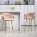 Set of two Giga pink counter height bar stools with wave back design, golden chromed base, footrest, ideal for kitchen island seating.