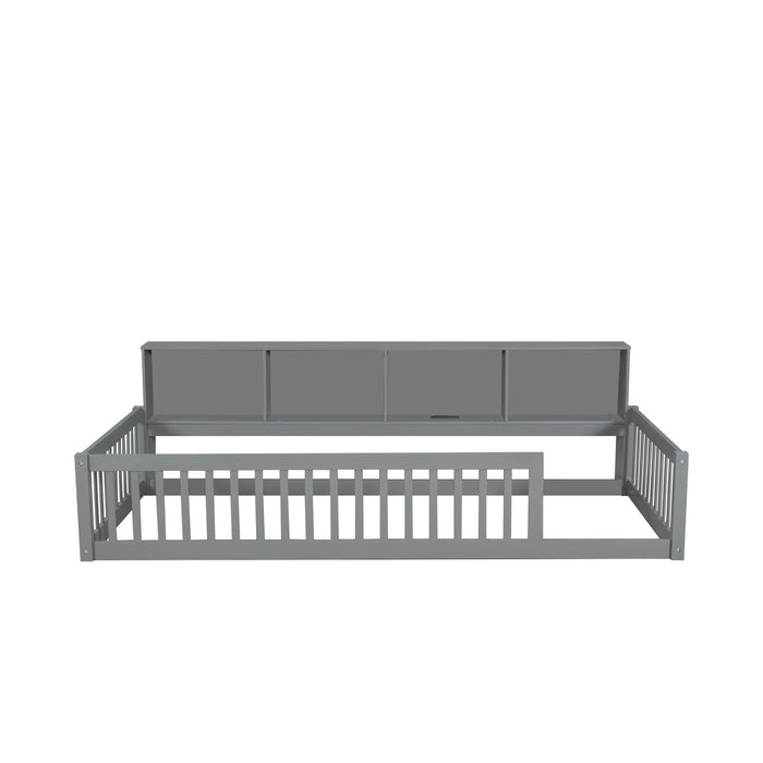 Gray Giga twin long platform floor bed with built-in storage cabinets and USB ports, shown with mattress and bedding.