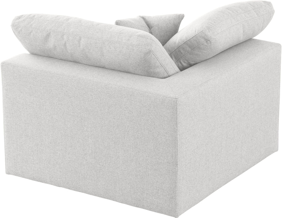 Meridian Furniture Serene corner chair with plush cushions and modern design, showcasing its sleek fabric upholstery and cozy corner style.