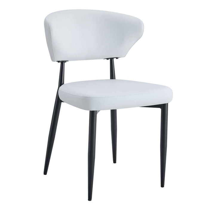 Set of four Giga minimalist ergonomic dining chairs with curved backs, stylish and comfortable for modern dining rooms.