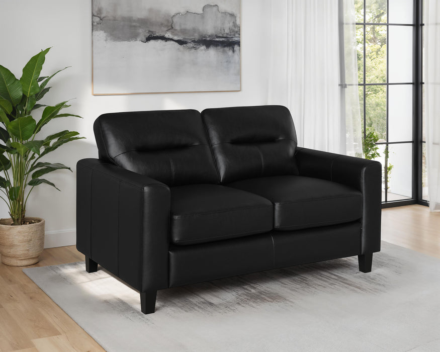 Black Scotland faux leather upholstered track arm loveseat by CoasterEveryday, showing the modern, plush furniture with sleek arm design.