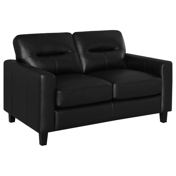 Black Scotland faux leather upholstered track arm loveseat from CoasterEveryday, showcasing plush seating and sleek modern design.