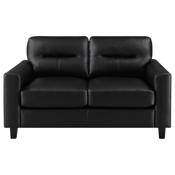 Black Scotland faux leather upholstered track arm loveseat from CoasterEveryday, showcasing plush cushioning and sleek modern design.