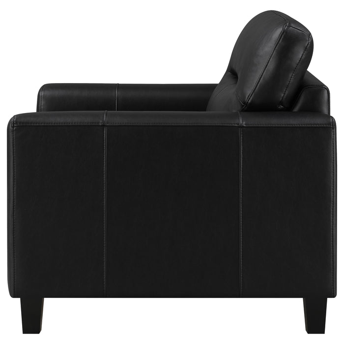 Black Scotland faux leather upholstered track arm chair with sleek modern design and sturdy wooden legs.
