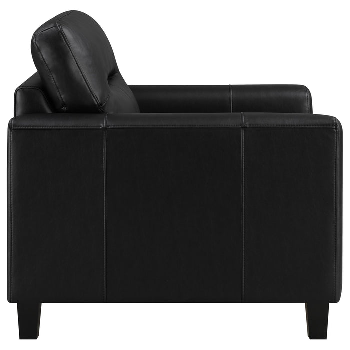 Black Scotland faux leather upholstered track arm chair, modern furniture piece with sleek design and comfortable seating.