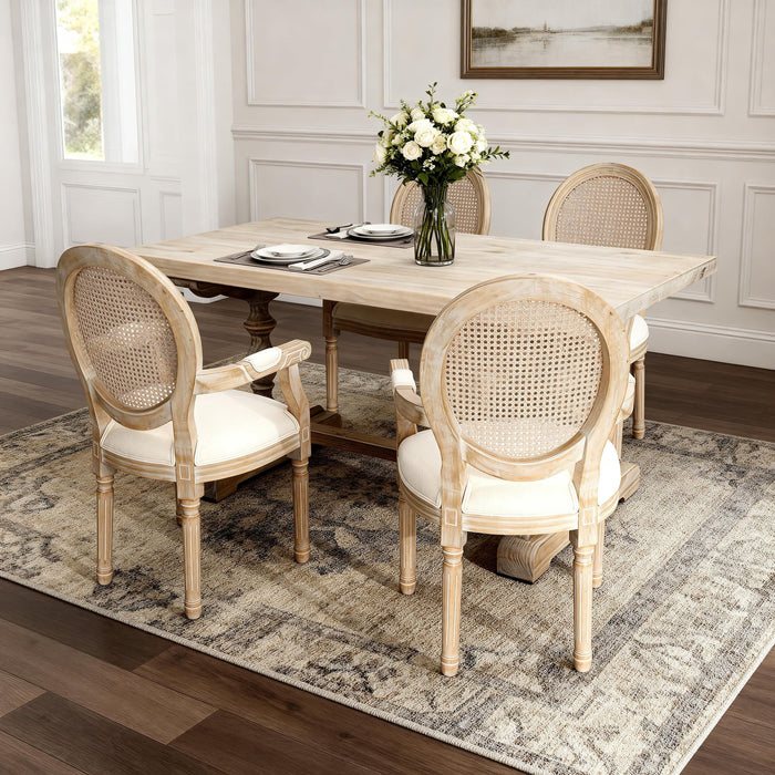 Set of two Giga French vintage upholstered fabric dining armchairs in beige with elegant curved arms and button-tufted backs.