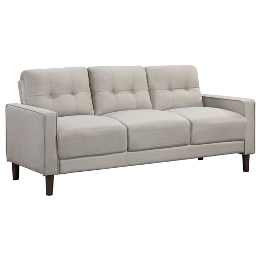 Beige CoasterEveryday Bowen upholstered track arm tufted sofa with plush cushions and clean lines