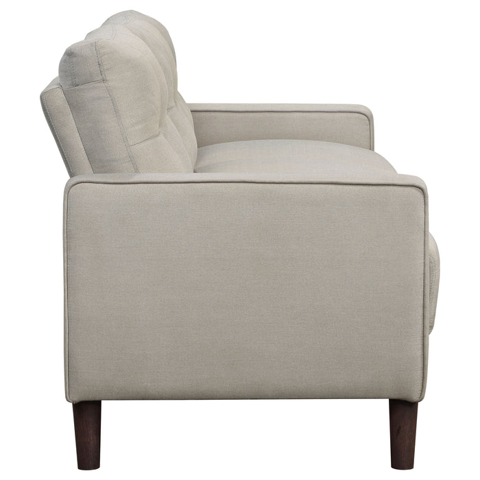 CoasterEveryday Bowen beige upholstered track arm tufted sofa with a tailored back and seat cushions