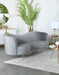 CoasterEssence Sophia grey upholstered channel tufted sofa with plush cushions and tapered legs