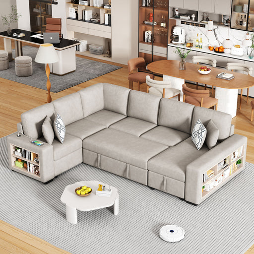 Giga U-shaped sectional sofa sleeper with pull-out bed, storage chaise, two USB ports, and four back pillows in a living room setting.