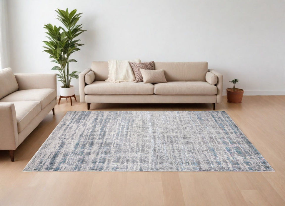 8' x 10' Abstract Power Loom Polyester Area Rug - Ivory Gray And Blue