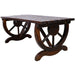 Rustic wooden bench with wagon wheel legs by Giga, ideal for garden or patio seating, featuring a brown finish and natural wood texture.