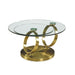HomeRoots 32-inch round glass and gold metal abstract coffee table with clear glass top and modern design.