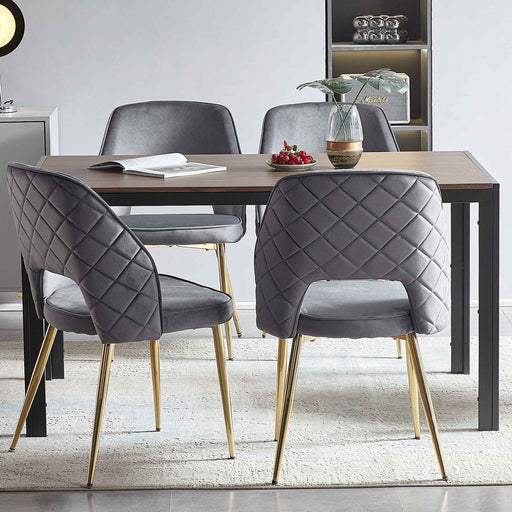 Set of Giga upholstered dining chairs with metal legs and hollow back, featuring comfortable padded seats and stylish design.