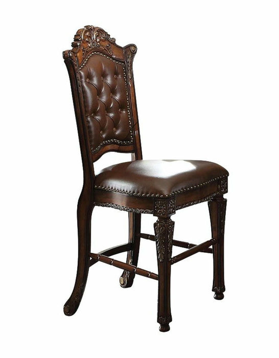 Set of two brown faux leather and solid wood counter height bar chairs with sleek design and sturdy legs.