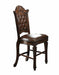 Set of two brown faux leather and solid wood counter height bar chairs with sleek design and sturdy legs.
