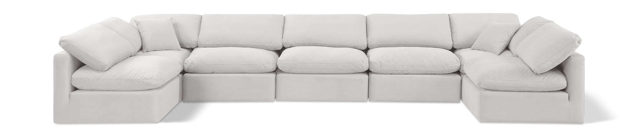 Velvet Meridian Furniture Indulge 7-Piece Modular U-Shaped Sectional sofa with plush cushions and modern design in a living room setting.