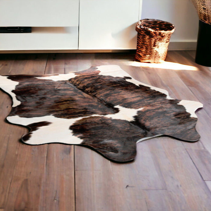 5' x 7' Hand Knotted Cowhide Area Rug - Dark Brown And White