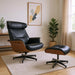 Black tufted genuine leather lounge chair with stainless steel frame and matching ottoman, featuring walnut wood accents for a modern look.