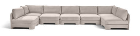 Meridian Furniture velvet U-shaped sectional sofa with armless design, upholstered in plush performance fabric, seven-piece set.