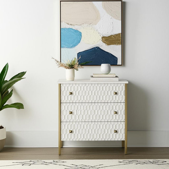 HomeRoots 32-inch wood and metal accent cabinet with carved geometric design, three drawers, in gold and white finish.