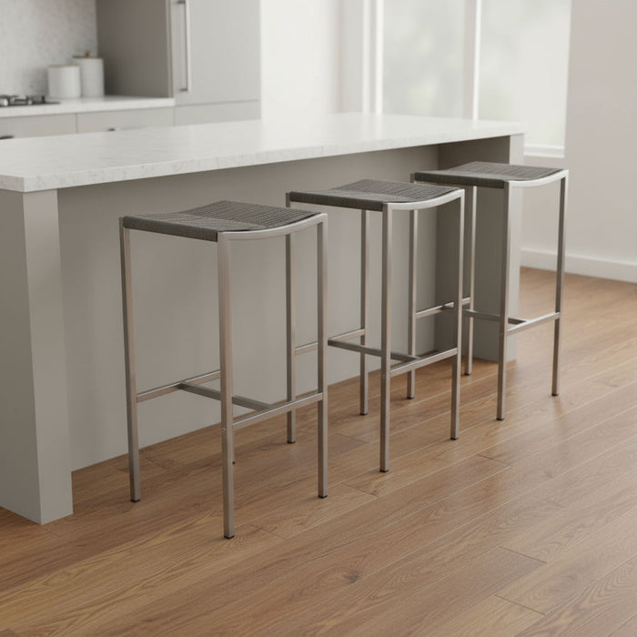 Set of four brown and silver stainless steel backless bar height stools from HomeRoots, showcasing sleek modern design.