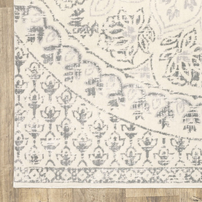 10' x 13' Floral Power Loom Stain Resistant Area Rug - Ivory And Gray