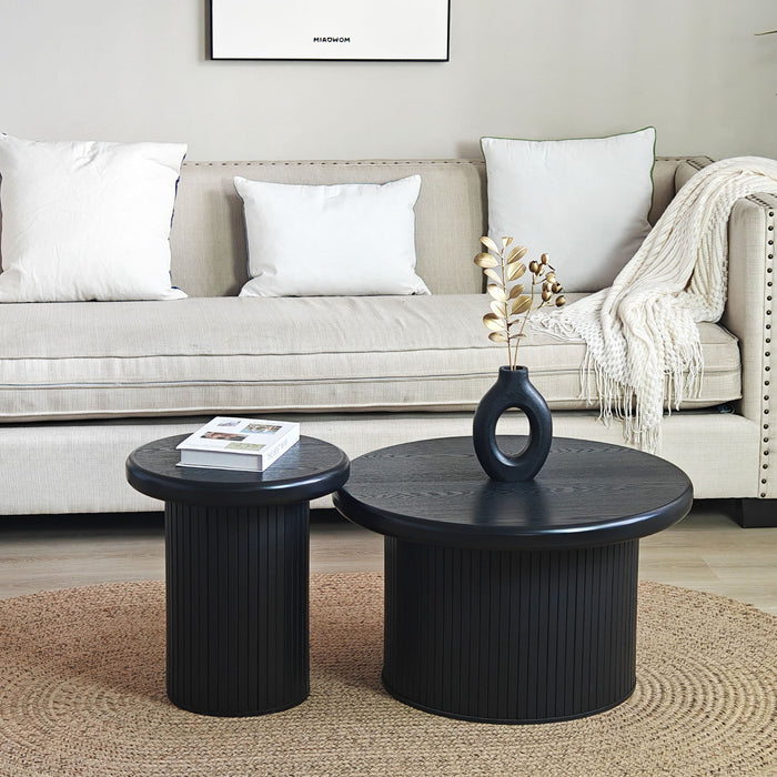 Set of two black Giga fluted cylinder side tables with round tops, ideal for living room decor and functional space.