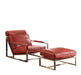 Red top grain leather lounge chair and ottoman by HomeRoots featuring a stationary design with gold accents.