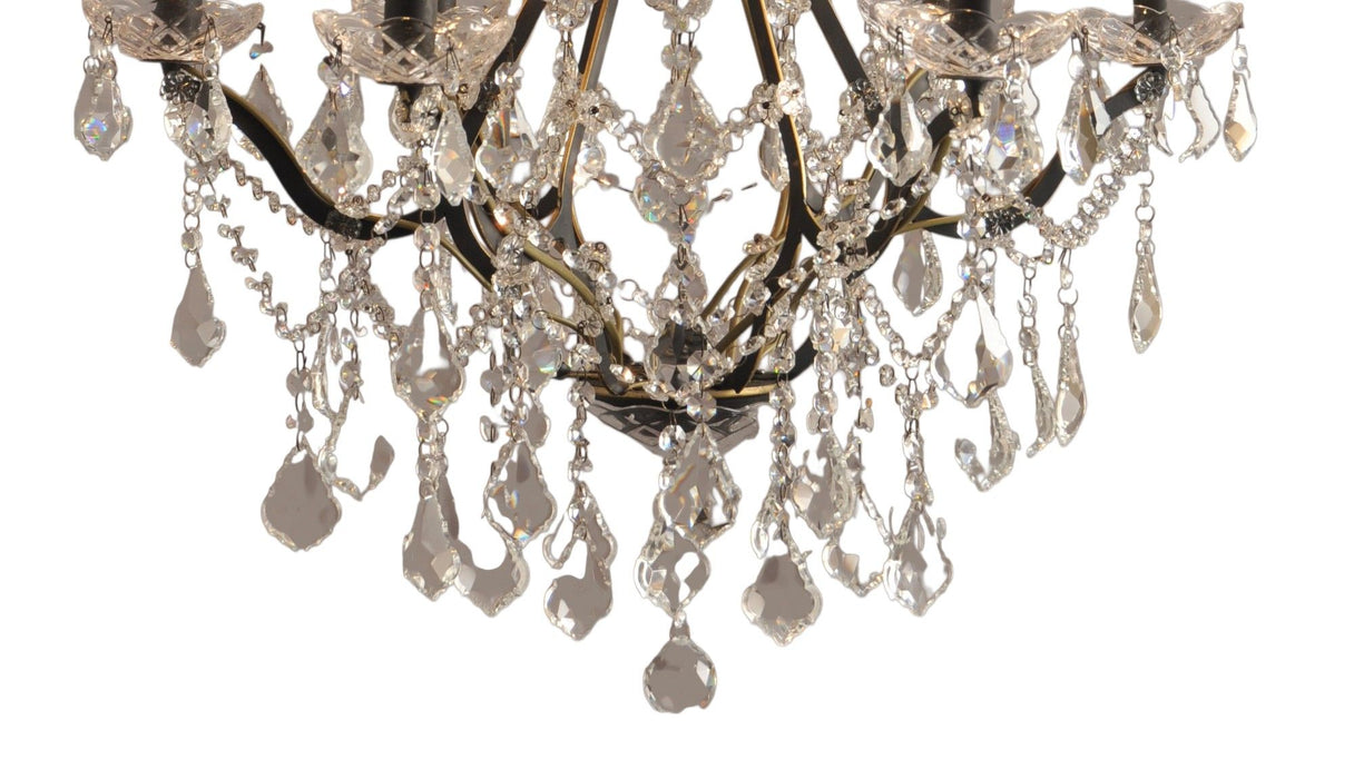 Black metal chandelier with six candle-style lights and crystal glass accents, designed by HomeRoots.