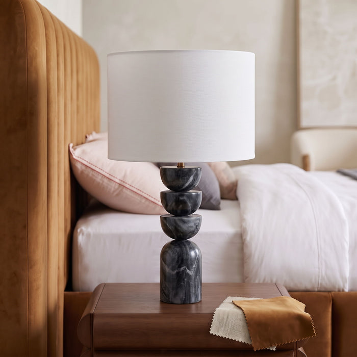 Meridian Furniture Opus marble and linen textured fabric brass table lamp with modern design and warm lighting.