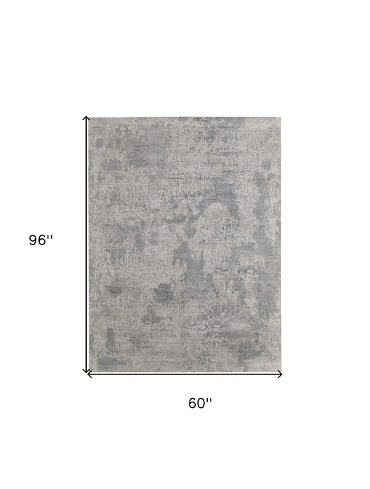 5' x 8' Casual Abstract Hand Woven Worn Faded Area Rug - Gray And Silver