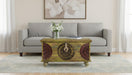 Carved wooden Mesa coffee table by HomeRoots with green and red finish, showcasing detailed carvings and sturdy rectangular design.