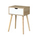 Giga mid-century modern white and wood side table with one drawer, bedroom accent nightstand with sleek design.