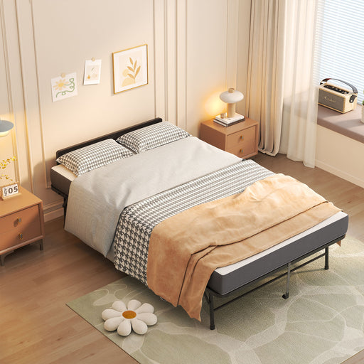 Black Giga twin extra long folding rollaway bed with adjustable headboard and memory foam mattress, folded open for sleeping comfort.