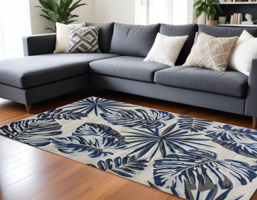 8' x 11' Machine Woven Oversized Tropical Leaves Indoor Area Rug - Gray Blue