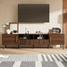 Giga walnut TV stand for TVs up to 85 inches with soft-close doors, open shelf, and cable management system.