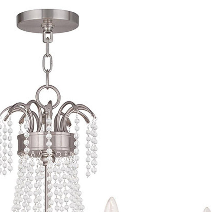 28-inch metal chandelier by HomeRoots with six clear shades and dimmable feature in nickel finish.