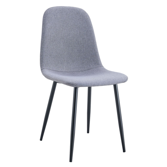 Set of four Giga luxury dining chairs with light gray linen cotton upholstery and black metal legs, designed for modern dining rooms.