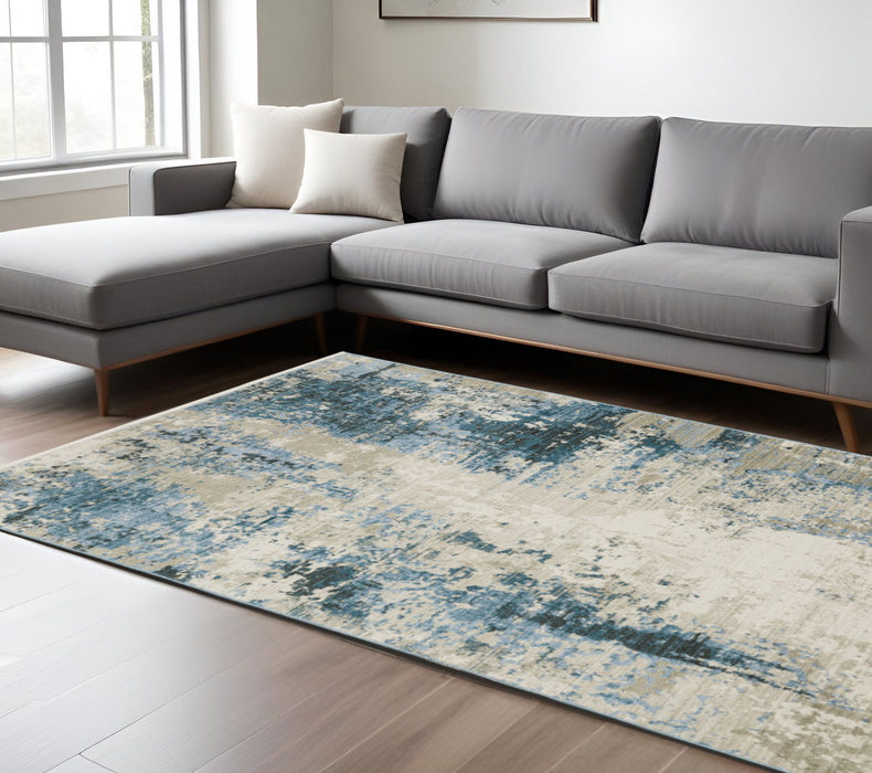 6' x 9' Abstract Power Loom Stain Resistant Area Rug With Fringe - Blue Gray Ivory Light Blue And Dark Blue