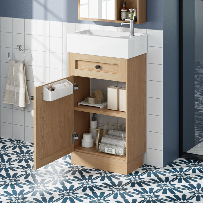 Wood bathroom vanity with reversible resin sink, cabinet storage, and zinc alloy handles by Giga, showcasing a modern bathroom fixture.