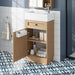 Wood bathroom vanity with reversible resin sink, cabinet storage, and zinc alloy handles by Giga, showcasing a modern bathroom fixture.