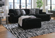 Signature Design by Ashley Midnight Madness stationary sectional with plush cushions and modern fabric, perfect for living room seating.