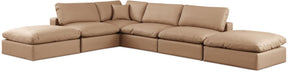 Tan faux leather Meridian Furniture Comfy 6-piece modular sectional with plush cushions and modern design, perfect for living room seating.