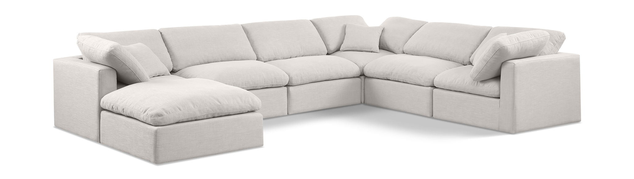 Meridian Furniture Indulge Linen 7-Piece Modular Sectional sofa with plush cushions and modern design, shown in a stylish living room setting.