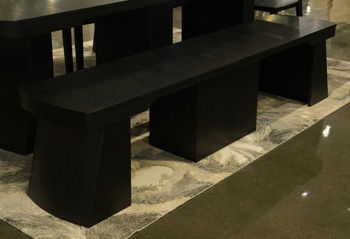 Black Haldenwick extra large dining room bench by Signature Design by Ashley® with a sturdy wooden frame and cushioned seat.